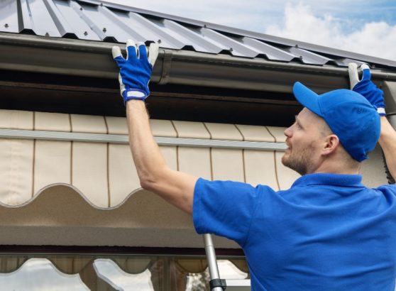 Technician installing gutter