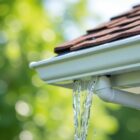 White gutter overflowing with water